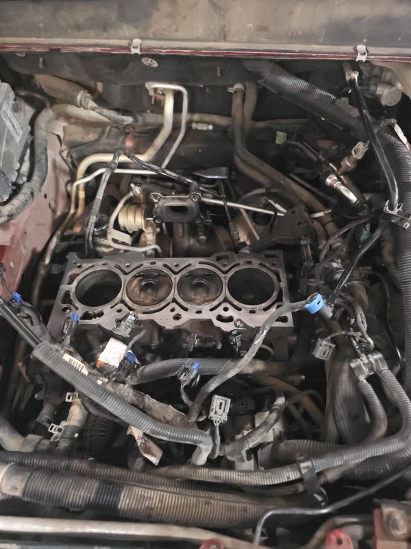 Engine teardown in progress at Town Square Auto, cylinder heads removed